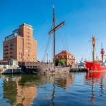 Фотография апарт отеля Appartment im Ohlerich Speicher in Wismar mit Stadt -und Meerblick