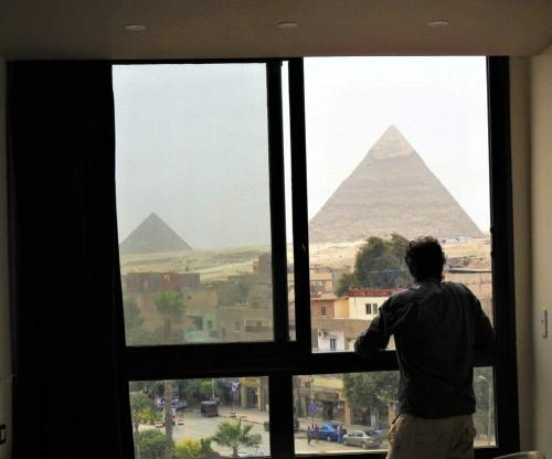 Фотографии гостиницы 
            Happy Days Pyramids View