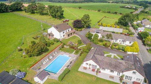 Фотографии гостевого дома 
            Trenewydd Farm Holiday Cottages