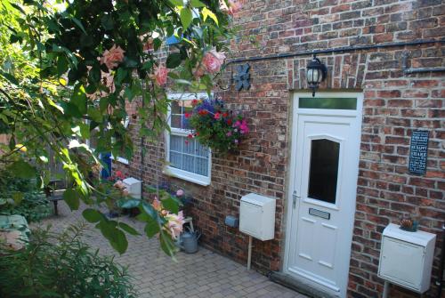 Фотографии гостевого дома 
            Saltburn Holidays Bluebell Cottage