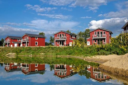 Фотографии гостевого дома 
            Holiday homes am See im Ferienpark Geesthof Hechthausen - DNS06018-FYA