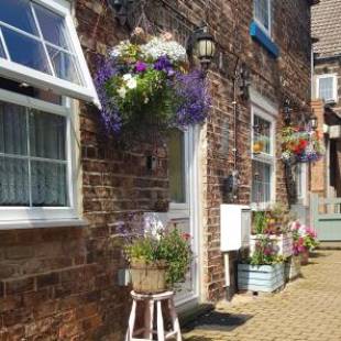 Фотографии гостевого дома 
            Saltburn Holidays Primrose Cottage