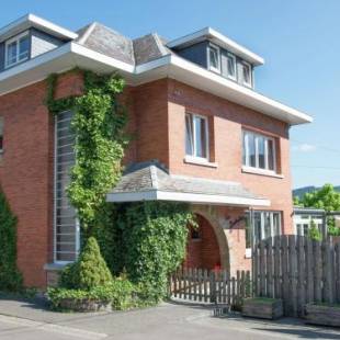 Фотографии гостевого дома 
            Attached house with playroom, indoor swimming pool, and sauna in a wooded area