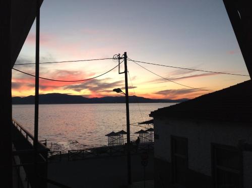 Фотография гостевого дома IRAKLIOS- Great sea view Studios--46m2--,,free WI-FI and private parking- next to VALLIS hotel-20meters from seaside!!!