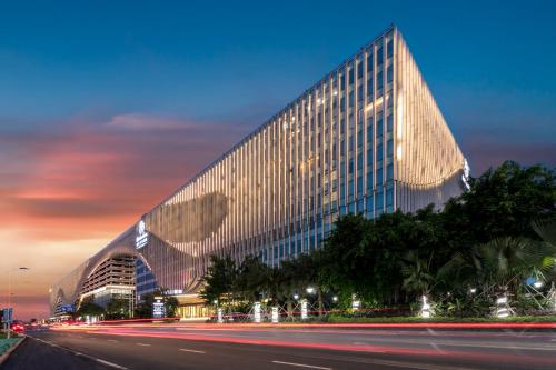 Фотографии гостиницы 
            Garden Lane Meilan Airport Hotel (formerly Haikou Meilan Airport Hotel)