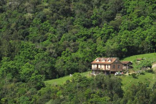 Фотографии базы отдыха 
            Pousada Pedras Rollantes - Estúdios Enxaimel