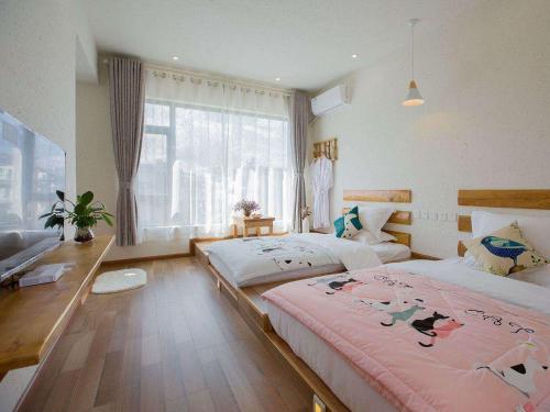 Фотографии гостевого дома 
            Qingwen Boutique Guesthouse