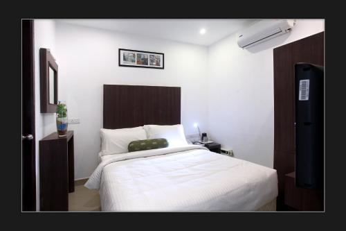 Фотографии гостиницы 
            Blu Ivy Serviced Apartments - Anna Nagar