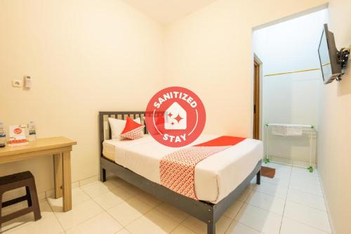 Фотография гостиницы OYO 936 Tremigo Guest House Syariah