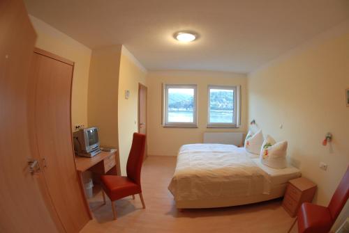 Фотография гостиницы Gastehaus Weingut Rossler