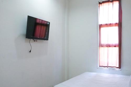 Фотография гостиницы RedDoorz Syariah near Universitas Jenderal Soedirman 2