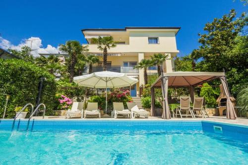 Фотография гостевого дома Family friendly apartments with a swimming pool Opatija - 7916