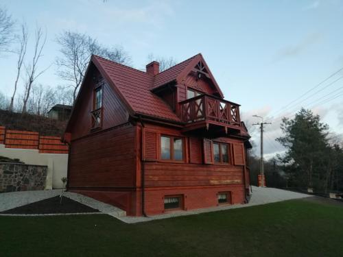 Фотография гостевого дома Całoroczny, Drewniany Domek letniskowy nad rzeką