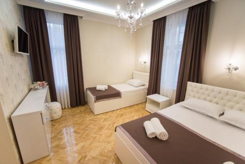 Фотографии мини отеля 
            Center Deluxe Garni Hotel