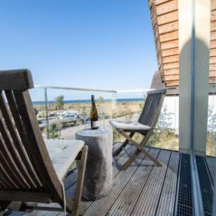 Фотографии гостевого дома 
            Ostsee - Reetdachhaus Nr 32 "Sonnendeck" im Strand Resort