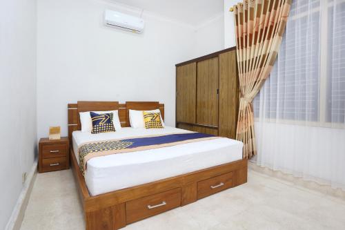 Фотографии гостиницы 
            OYO 2268 Tim-tim Homestay