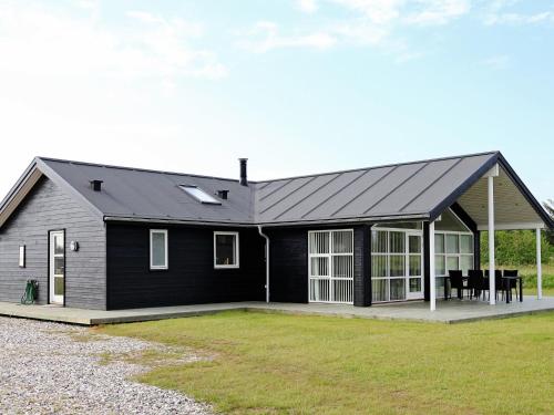 Фотография гостевого дома Four-Bedroom Holiday home in Løkken 26