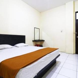 Фотографии гостевого дома 
            Guest House Taman Sari Syariah