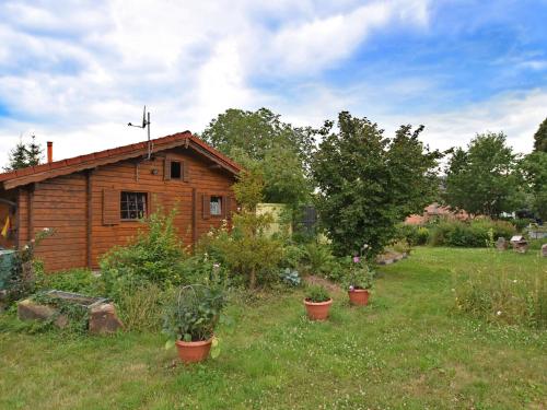 Фотография гостевого дома Beautiful wooden holiday home in Hesse with private garden and a large terrace