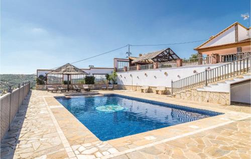 Фотографии гостевого дома 
            Nice home in Iznájar w/ Outdoor swimming pool, WiFi and 4 Bedrooms